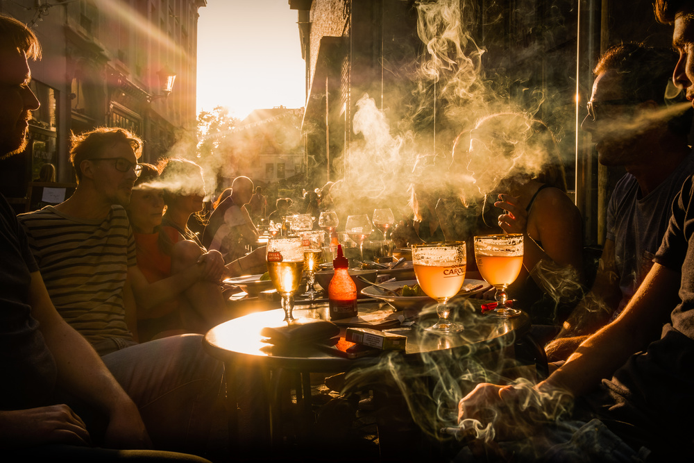 Belgian sunset, beer and cigarettes van Adrian Popan