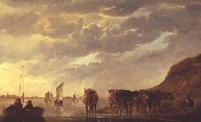 A herdsman with five cows by a river