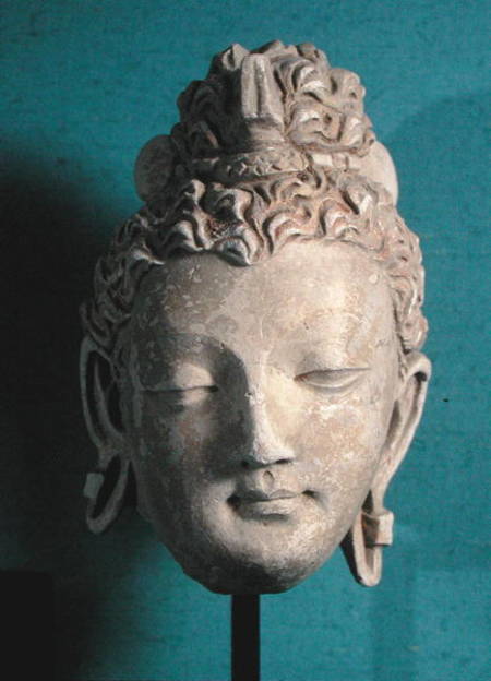 Head of a Smiling Buddha, Greco-Buddhist style, from Hadda van Afghan School
