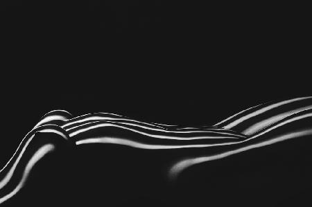 Beautiful body girl in the white line on a black background.