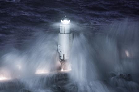 The lighthouse in the stormy night