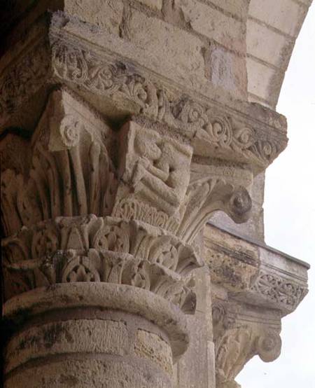 Column capital with stylised foliage designs around the figure of an acrobatfrom the porch exterior van Anoniem