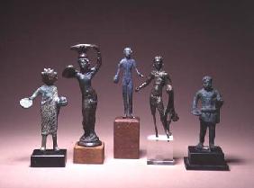 Collection of Etruscan antiquities including a figure of Hercules and a patera handle in the form of
