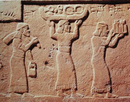Relief depicting porters laden with gifts van Assyrian