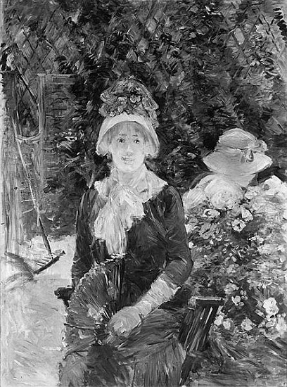 Young Woman in a Garden van Berthe Morisot
