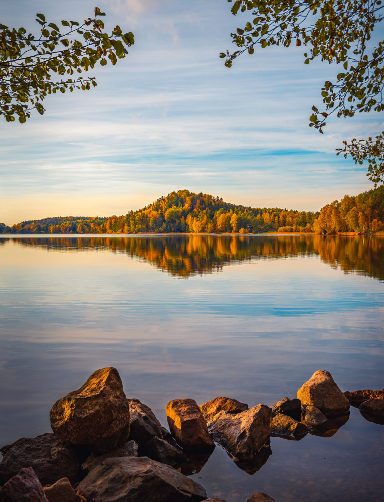 Autumn lake with a small mountain in the background van Christian Lindsten