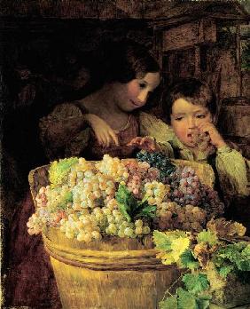 Zwei Kinder an einer mit Trauben gefüllten Bütte