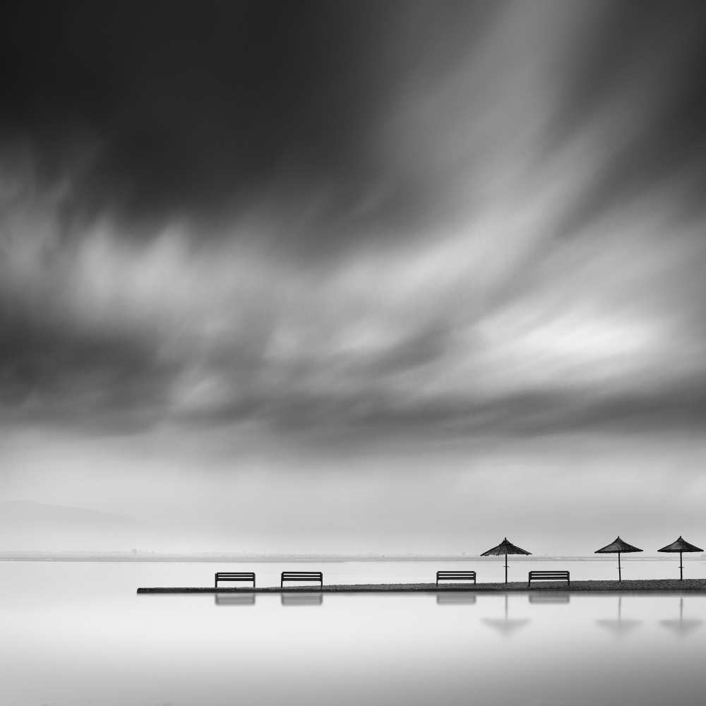 Four Benches and three umbrellas van George Digalakis