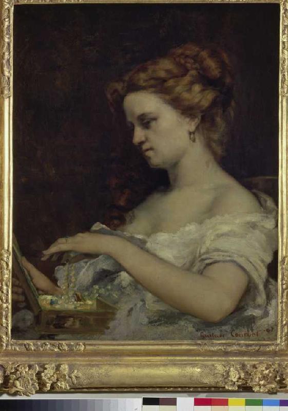 Die Dame am Schmuckkasten van Gustave Courbet
