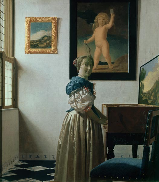 Vrouw staand achter het virginaal Johannes Vermeer van Johannes Vermeer 