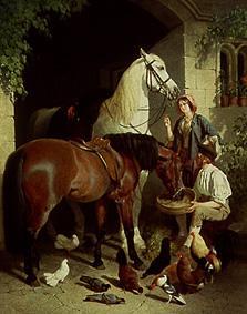 Beim Füttern der Pferde van John Frederick Herring d.Ä.