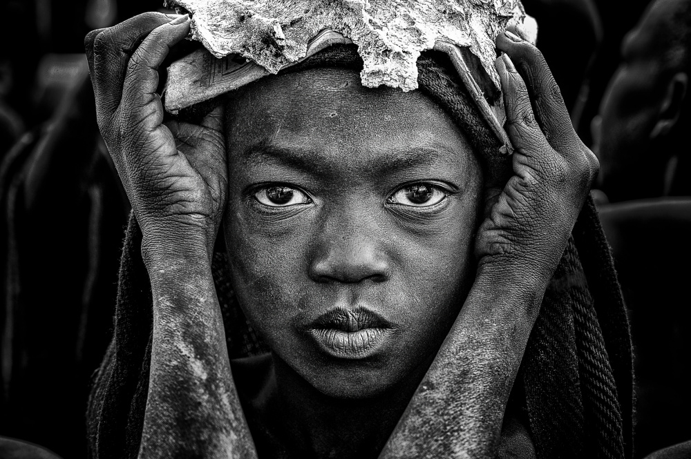 Surmi tribe child with an animal bone in his head. van Joxe Inazio Kuesta Garmendia
