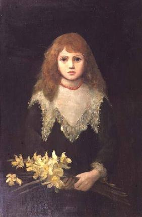Portrait of a young girl with a bouquet of daffodils