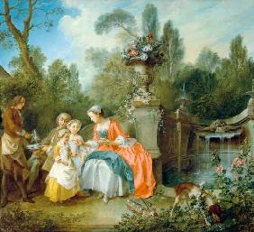 Eine Dame im Garten, die mit einigen Kindern Kaffee trinkt