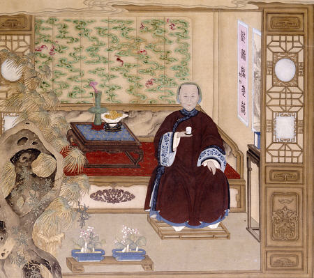 A Lady In Dark Red, Seated On A Day Bed Holding A Blue And White Cup van 