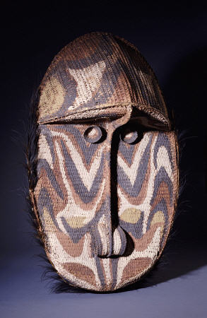 A Large Iatmul Woven Rattan Gable Mask, Of Oval Form With Projecting Forehead van 