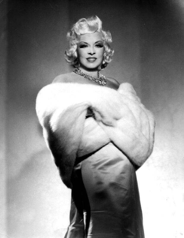 American Actress Mae West with fur stole van 