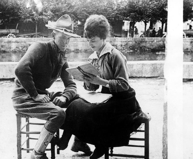 American soldier learning French with a French woman van 