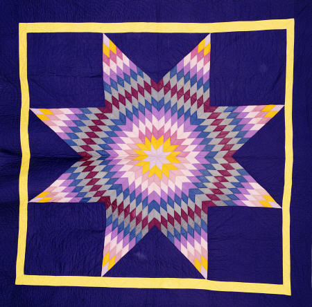 An Amish Pieced & Quilted Cotton Coverlet Worked In A Multicolored Lone Star On A Navy Background van 