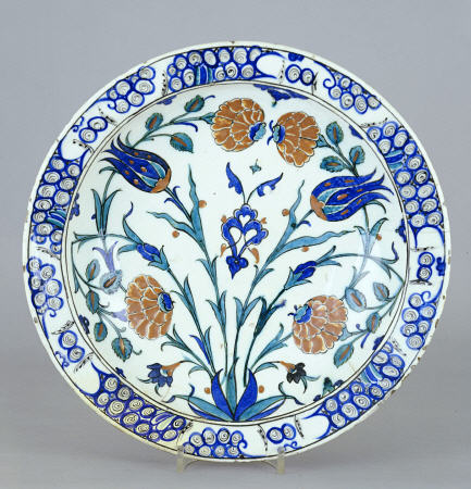 An Iznik Pottery Dish With Tulip And Peony Design, C van 