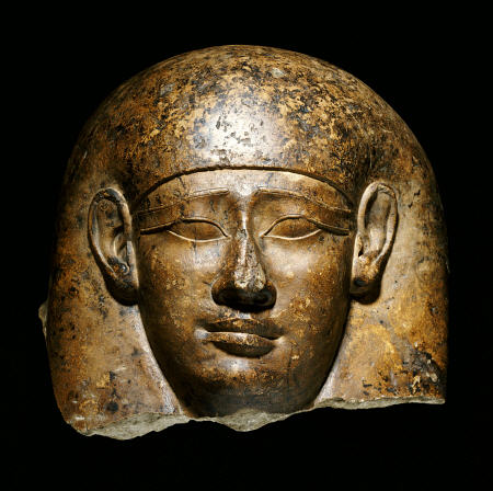An Over Life-Size Limestone Head From An Anthropoid Sarcophagus van 