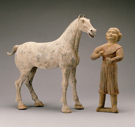 A Painted Grey Pottery Group Of A Horse And Groom van 