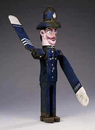 A Polychrome Wood And Metal Whirligig Modelled As A Police Sergeant, 20th Century van 
