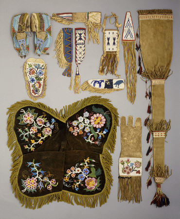 A Selection Of Native American Artefacts Including A Pair Of Sioux Beaded Moccasins And Skin Mirror van 