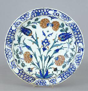 An Iznik Pottery Dish With Tulip And Peony Design, C