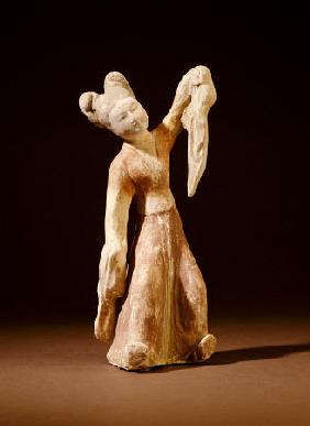 A Painted Pottery Figure Of A Dancer