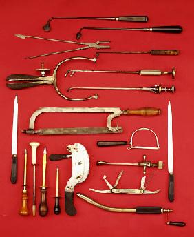 A Selection Of Medical Equipment Including Knives, Saws, Bullet Extractors,  Cauterisers, Lithotrite