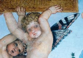 cherub holding a plate with butterfly wings. 