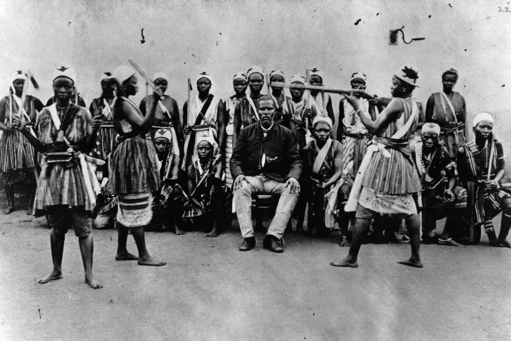 Female warriors from Dahomey, Benin,practising with weapons in front of Chacha, head and viceroy of  van 