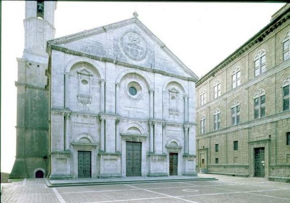 Facade of the Cathedral designed by Bernardo Rossellino (1409-64), the pediment bearing the papal ar van 