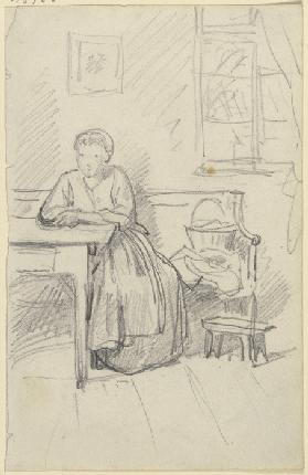 Woman sitting at a table