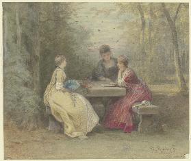 Vorlesung im Park, drei junge Damen in Watteauschem Kostüm um einen Steintisch sitzend (Laube am San