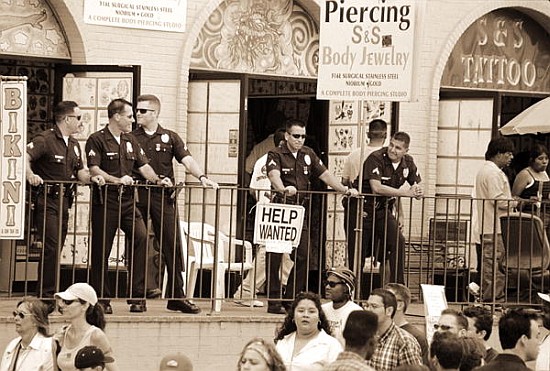 Police gathered behind a ''Help Wanted'' sign, 2004 (b/w photo)  van Stephen  Spiller