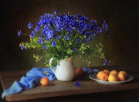 Still life with cornflowers and apricots
