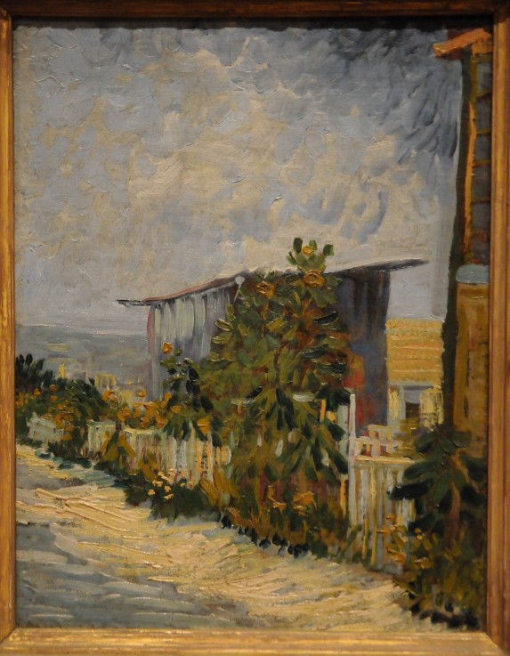 Shed at the Montmartre with sunflower van Vincent van Gogh